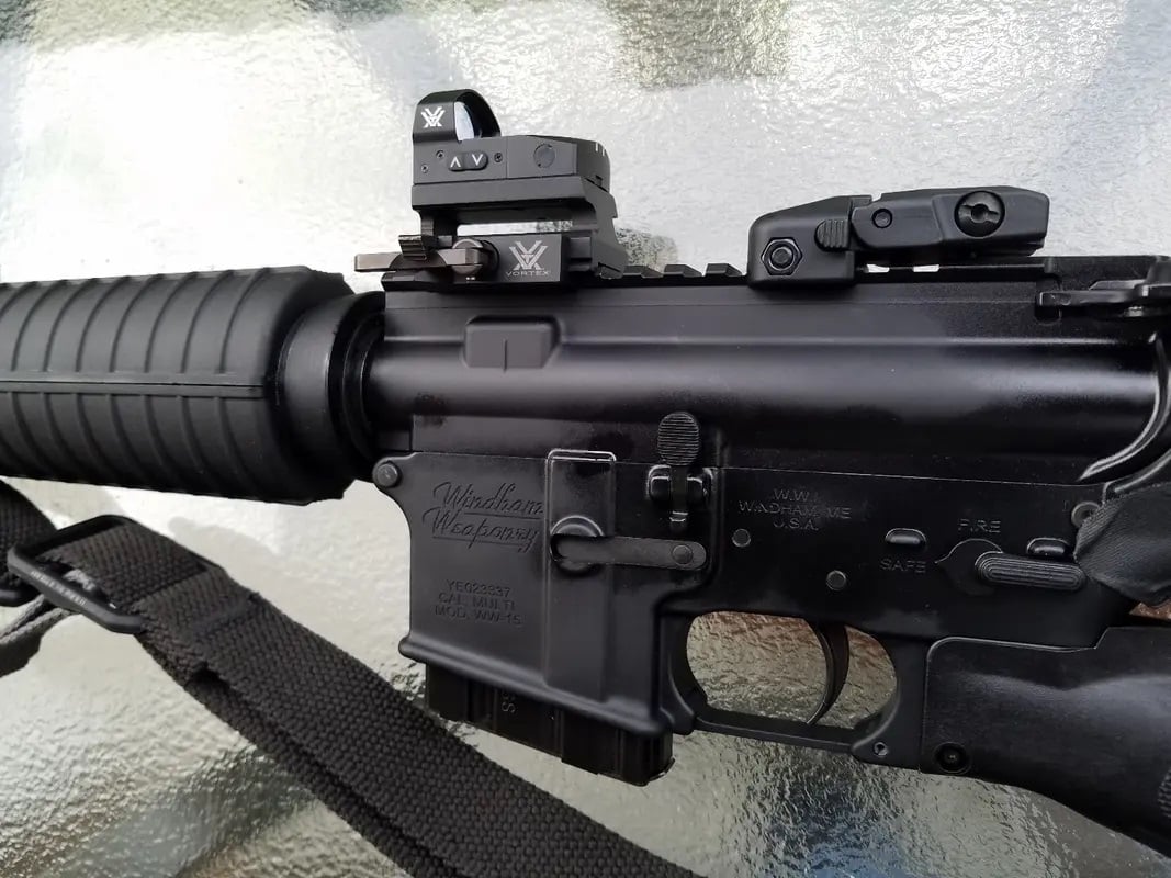 ar15 with an open style red dot reflex sight Vortex