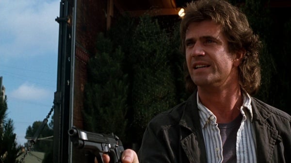 Martin Riggs holding his Beretta 92F