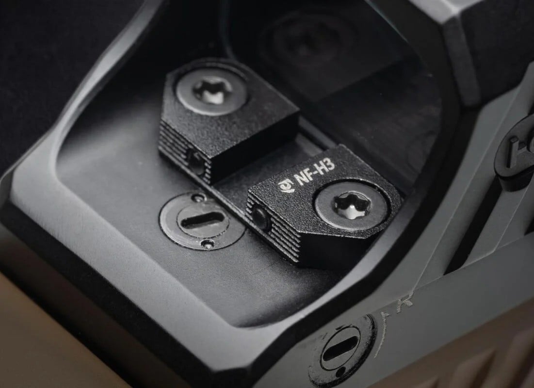 night fision optics mounted sights on a holosun